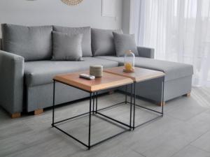 a living room with a couch and a table at Mythical Sands - Orion in Protaras