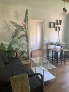 a living room with a couch and a table at Pantin Paris in Pantin