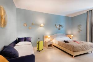 Postelja oz. postelje v sobi nastanitve Piccolo Imperiale