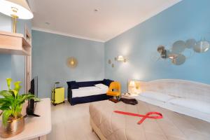 Postelja oz. postelje v sobi nastanitve Piccolo Imperiale