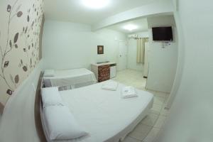 Postelja oz. postelje v sobi nastanitve Hotel Sambakia