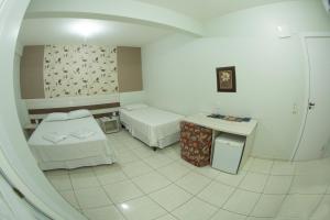 Postelja oz. postelje v sobi nastanitve Hotel Sambakia