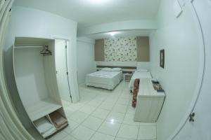 Postelja oz. postelje v sobi nastanitve Hotel Sambakia