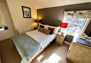 Ein Bett oder Betten in einem Zimmer der Unterkunft Ravenstone Lodge Country House Hotel