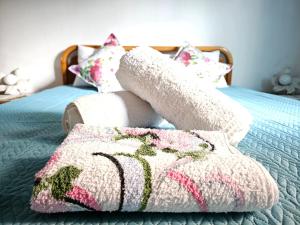 a bed with a blanket and pillows on it at Dreamer's Home Chrisa in Limenas