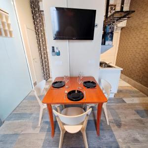 a dining room with a wooden table and chairs at LOFT DELUXE - MADRID RETIRO in Madrid