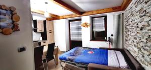 Katil atau katil-katil dalam bilik di Bilocale Nel Cuore Della Val Di Fiemme