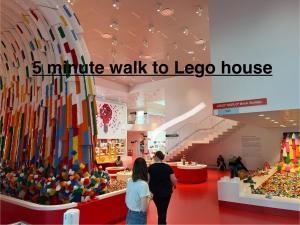 people walking through a lego house in a store at 5 minute walk to LEGO house - n3 in Billund