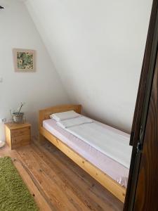 a bedroom with a bed in a attic at Bloossom house in Bajina Bašta