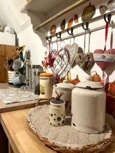 a kitchen counter with pots and pans on a table at Bloossom house in Bajina Bašta