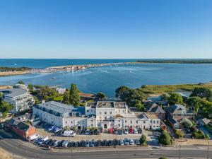 an aerial view of a house and the water at Harbour Hotel & Spa Christchurch in Christchurch