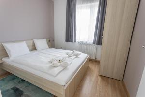 Ліжко або ліжка в номері Maple Tree Budget Apartments