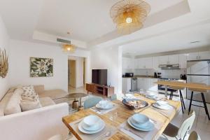 a living room with a table and a couch at The Springs - Tranquil Two Bedroom Villa in Dubai