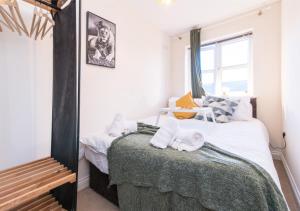 a bedroom with two beds and a mirror at Derby Parliament Spacious 2Bedroom Apartment with Parking in Derby