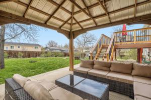 a living room with a couch and a table at Centrally located for adventures in Westminster