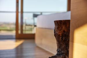 a close up of a tree stump in a room at Le Marne Relais in Costigliole dʼAsti