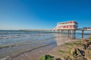a pier on the beach next to the ocean at Warm Cozy Hideaway Texas City 1 Bed Flat in Texas City