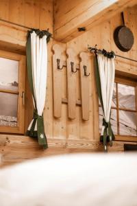 a room with curtains and a window in a cabin at Chalet Edelweiß in Saalbach-Hinterglemm