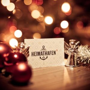 a christmas card on a table with christmas decorations at Heimathafen in Büsum