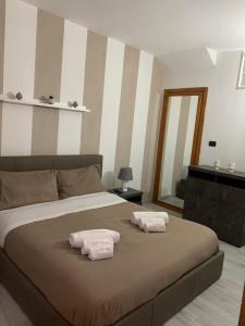 Postel nebo postele na pokoji v ubytování Cocciu d’amuri Apartment