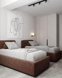 Dastan Hotel Baku tesisinde bir odada yatak veya yataklar