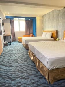 Un pat sau paturi într-o cameră la Yiting Hotel