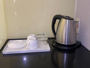 a coffee maker sitting on top of a counter at Yiting Hotel in Kaohsiung