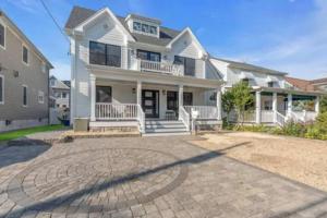 a large white house with a large driveway at Belmar NJ 5 Min Walk to Beach, Sleeps 16+ in Belmar