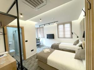 Letto o letti in una camera di Hotel NPL CODE