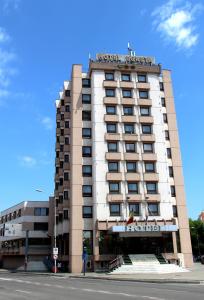 a hotel building on the corner of a street at Hotel Egreta in Tulcea