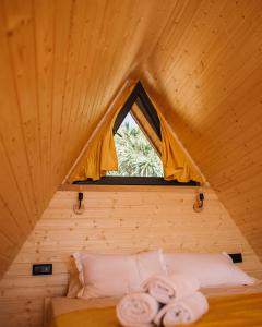 Säng eller sängar i ett rum på cottage petra