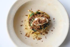 a white plate with a dish of food on it at Housel Bay Hotel in Lizard