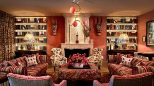 a living room with couches and a fireplace at Warren Street Hotel in New York