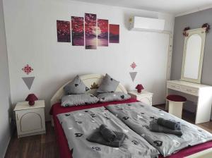 a bedroom with a bed with pillows on it at Holiday home in Kereki - Balaton 48110 in Kereki