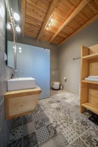 a bathroom with a sink and a toilet at Villa Kalimera swimming pool Pitsidia Matala Komos in Pitsidia