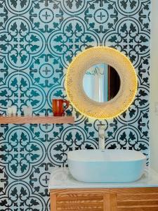 a bathroom with a sink and a mirror at Vui Homestay in Xóm Trương Quít +13 photos