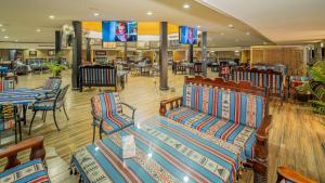 a shopping mall with benches in the middle of it at Al Dar Inn Hotel Apartment in Ras al Khaimah