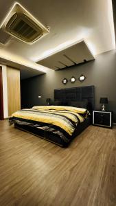 a bedroom with a large bed in a room at Luxury apartment in Gold Crest Mall 1 bed in Lahore