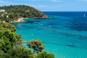 an aerial view of a beach with boats in the water at Appart Rez de jardin vue mer in Cavalaire-sur-Mer