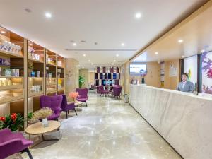 a salon with purple chairs and a counter at Lavande Hotel Guangzhou Shatai South Road Tianpingjia Metro Station in Guangzhou