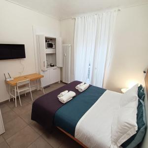Łóżko lub łóżka w pokoju w obiekcie Piccole suite di charme