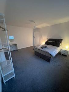 a bedroom with a bed and a ladder in it at House in London near O2, Greenwich & Canary Wharf in Eltham