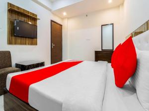 Lova arba lovos apgyvendinimo įstaigoje OYO Flagship 81052 Hotel Elite Inn
