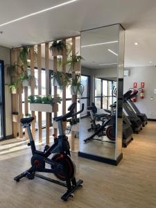 a gym with treadmills and exercise bikes in a room at Quality Hotel Manaus in Manaus