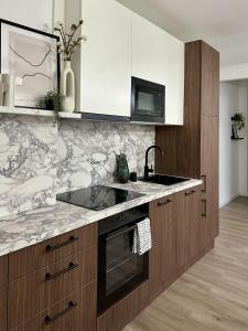 a kitchen with a sink and a counter top at D26 Luxury Suites in Budapest