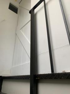 eine Glastür in einem Zimmer mit einer Decke in der Unterkunft Van der Welle - Ndd in Amsterdam