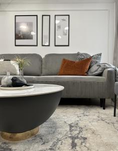 a living room with a couch and a coffee table at D26 Luxury Suites in Budapest