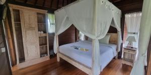 Postel nebo postele na pokoji v ubytování Pandawa Villas Ubud