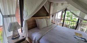 Postel nebo postele na pokoji v ubytování Pandawa Villas Ubud