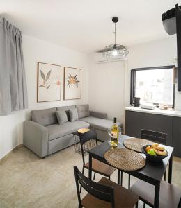 a living room with a couch and a table at Sublet TLV 270 in Tel Aviv